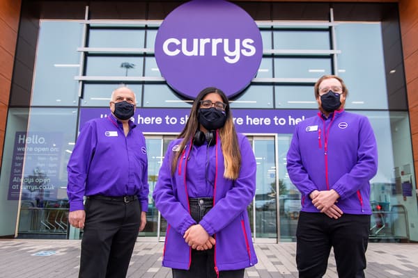 Staff at a branch of Currys showed off its new name this summer. Image courtesy of Currys
