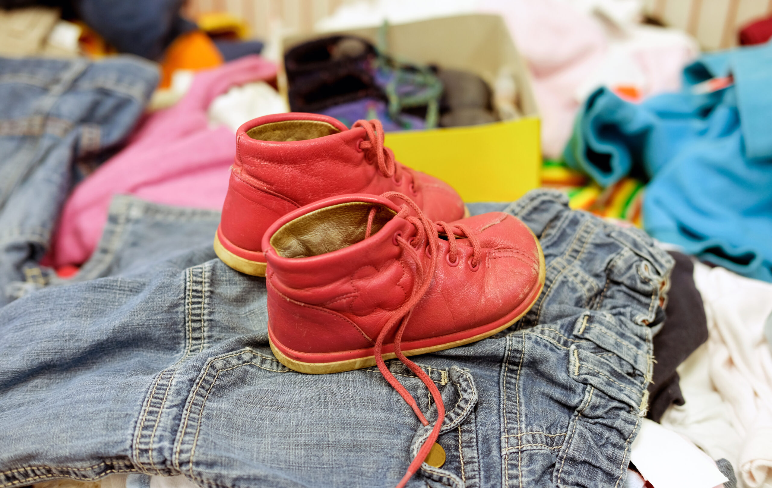 Used,Red,Shoes,For,Children,In,A,Thrift,Shop,Between
