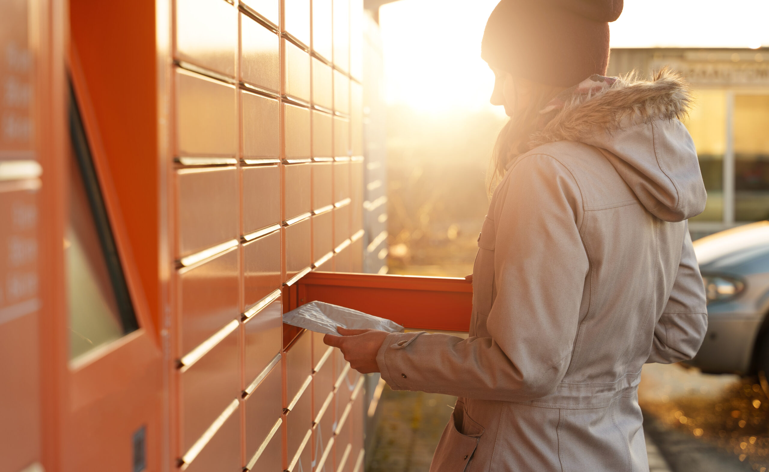 Woman,Picks,Up,Mail,From,Automated,Self-service,Post,Terminal,Machine.