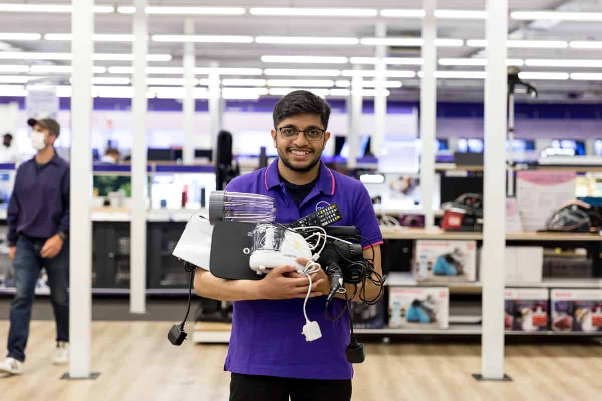 retail-colleague-holding-electronics-for-repair-recycling-1 (2) (1)
