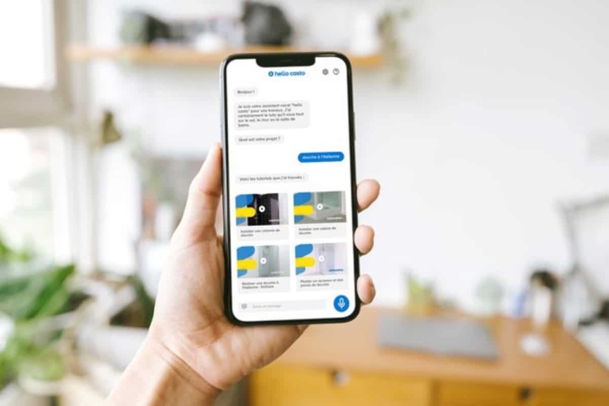 A picture of a hand holding a mobile phone with a Hello Casto screen displayed.