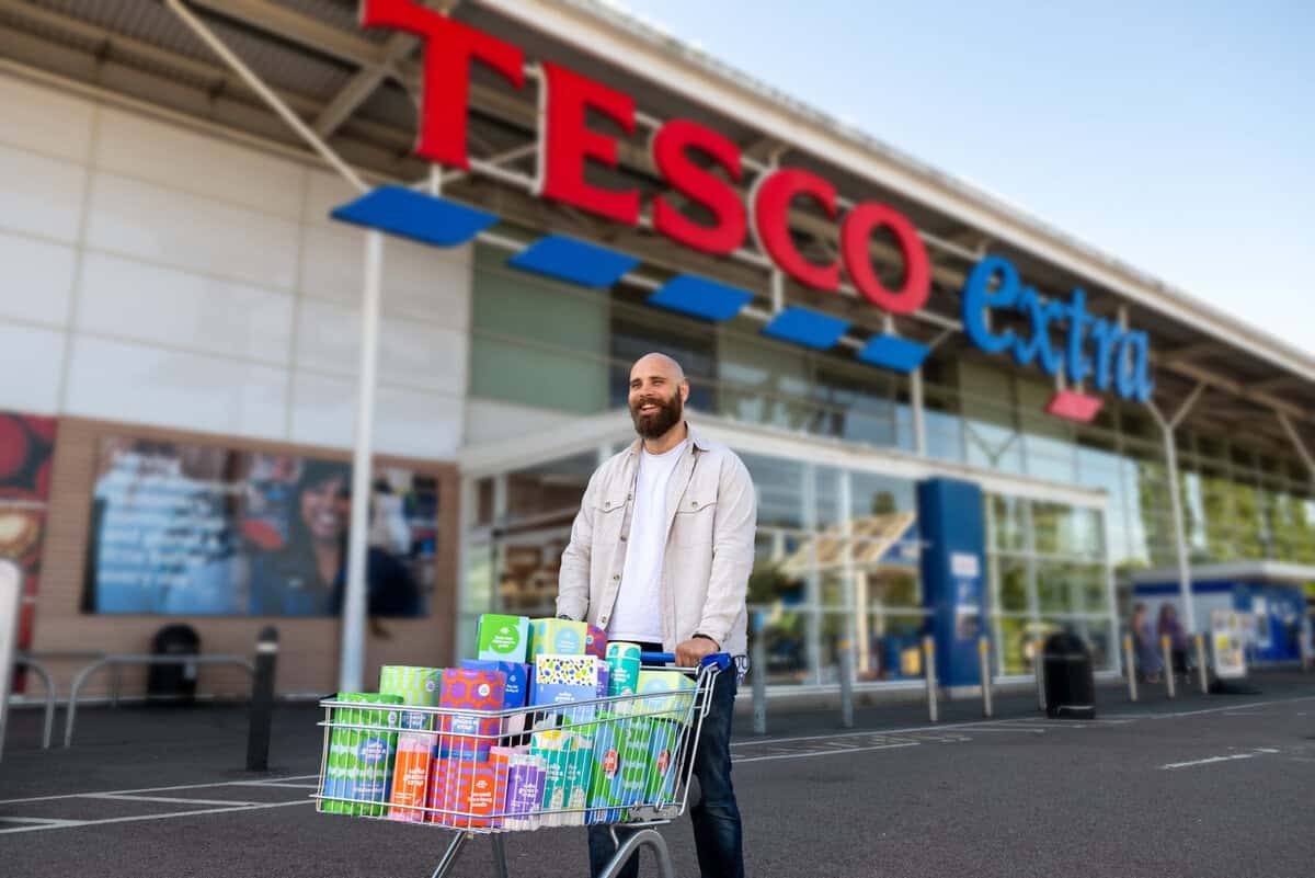 Shopper with a Tesco trolley full of Who Gives A Crap products